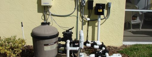 A Hayward pool pump, newly installed next to a home.
