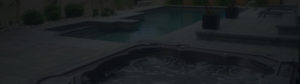 A darkened image of a pool and hot tub for a footer