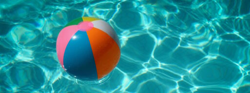 A beach ball floating in a pool