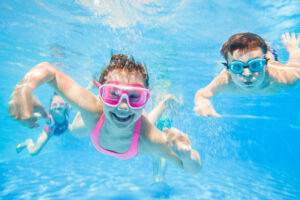Kids swimming and having fun in the pool