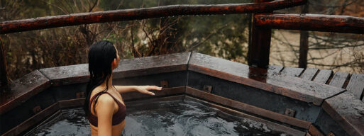 Women in hot tub looking out in the wild